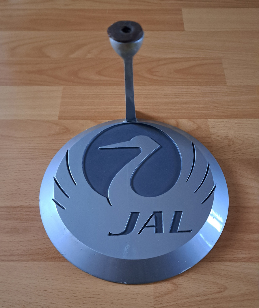 Original JAL circular model base/stand with crane insignia for sale
